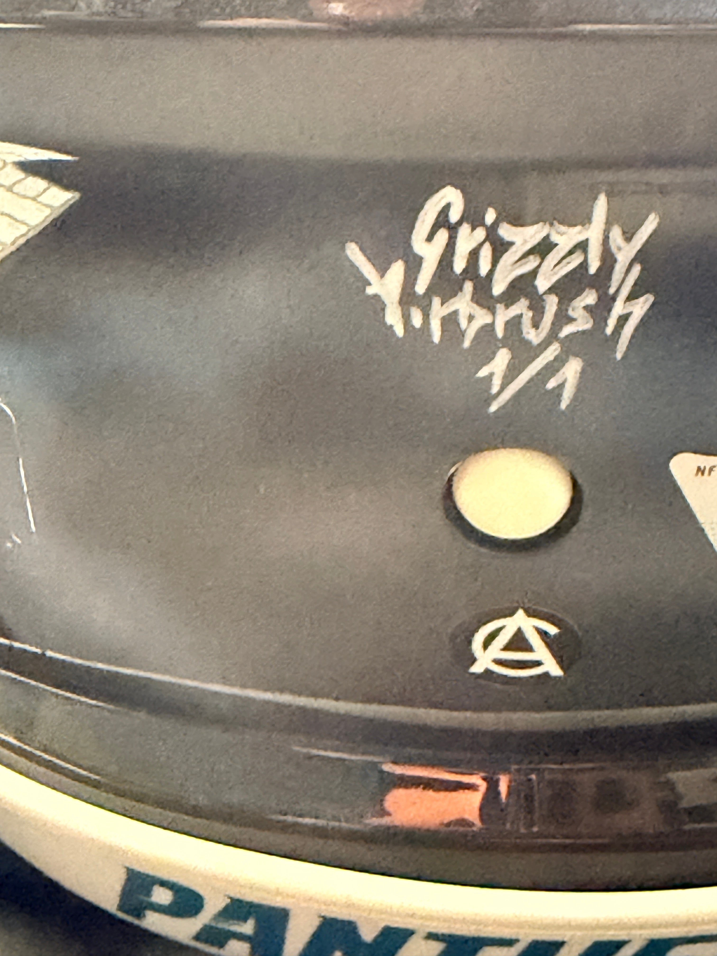 Grizzly signature with the Art Cabal AC mark below it