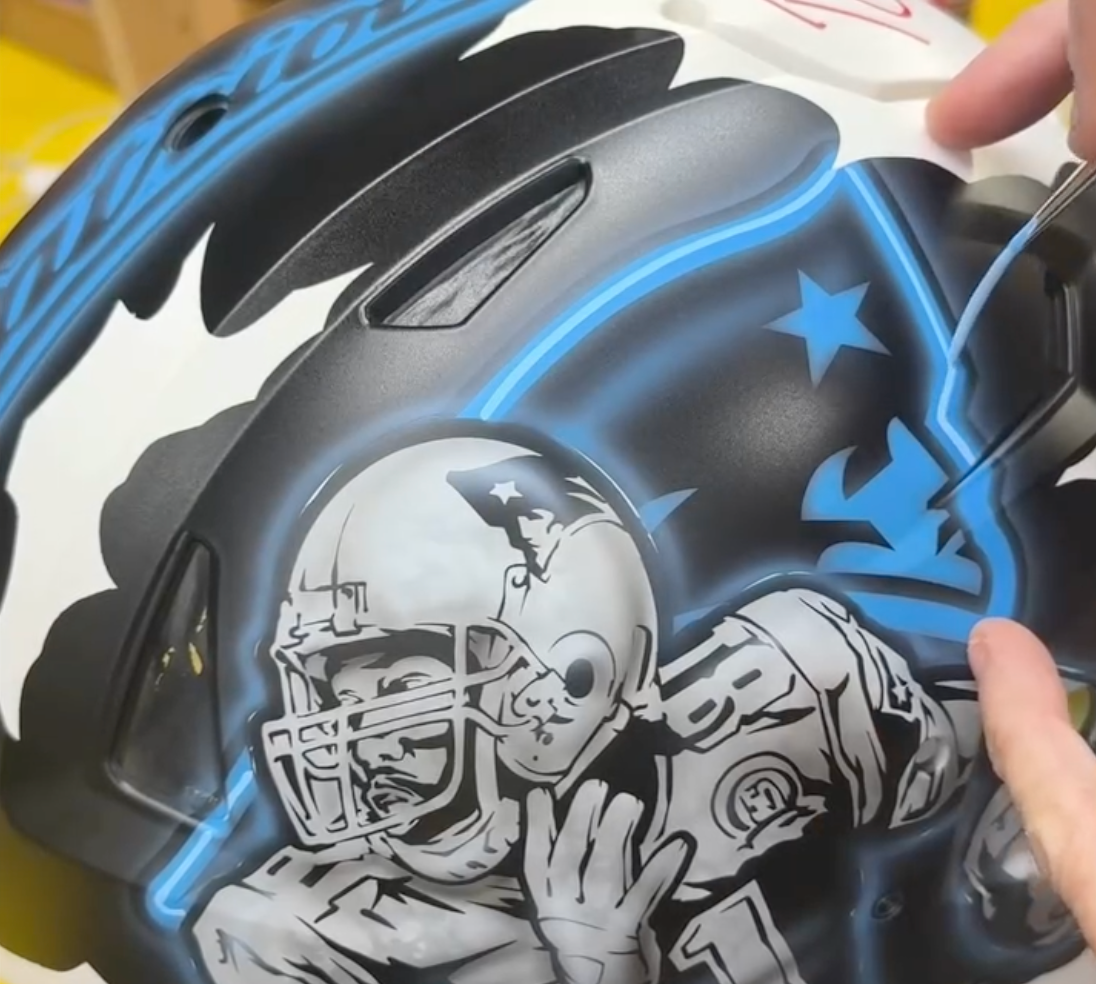 Detailed New England Patriots custom art helmet being painted by Nub Grafix