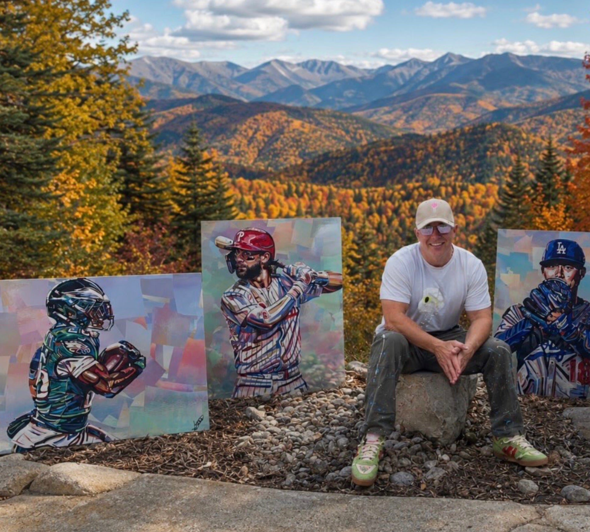 Shawn Voelker with original football and baseball portrait paintings